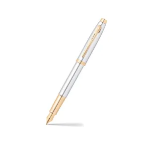 Pluma Sheaffer Serie 100 GT Cromo con cuerpo metálico plateado y detalles dorados, plumín de acero inoxidable bicolor, presentada en estuche elegante Sheaffer con guía de bienvenida.