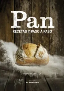 Pan recetas y paso a paso portada del libro de panadería con hogaza artesanal sobre mesa rústica